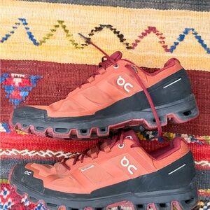 On Women’s Waterproof tracking Shoes in burgundy with Black Trim